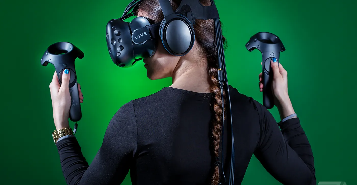 A player in an HTC VIVE headset with motion controllers